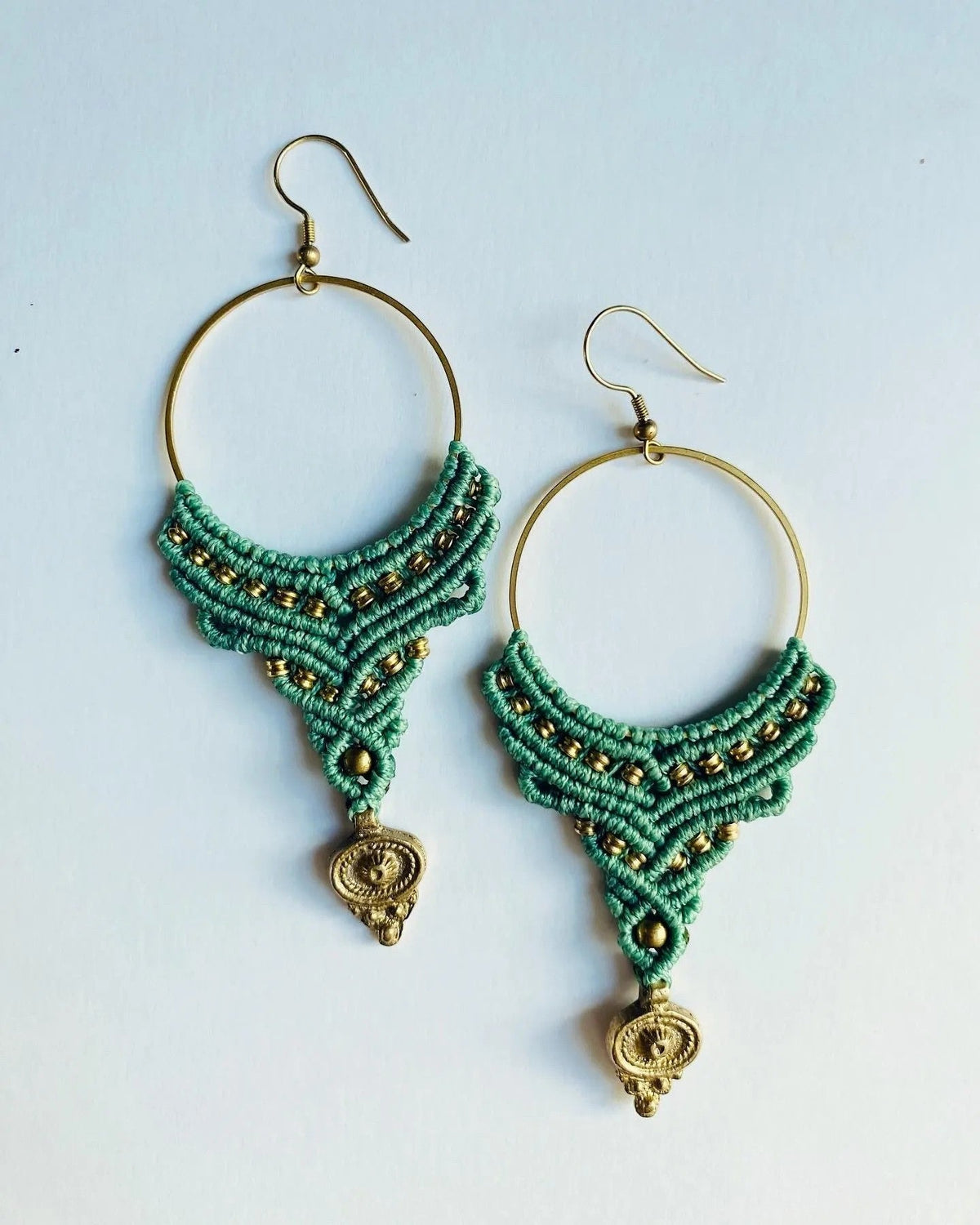 Teal macrame hoop earrings with gold charm drop